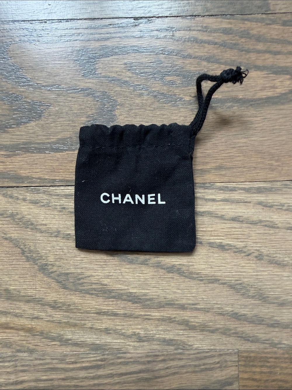 CHANEL Black Drawstring Jewelry Pouch with White Logo